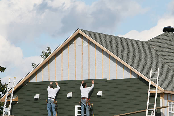 Professional Siding Installation technician working in Inwood, WV